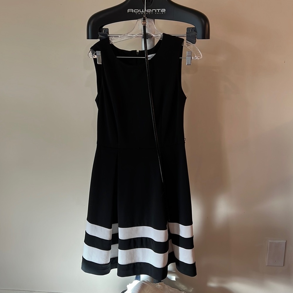 Classic A line with belt. Very comfortable worn with a white cropped sweater